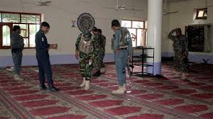 Afghan policemen inspect a mosque after a blast in Khost Province, Afghanistan, May 6, 2018. (Photo by Reuters)