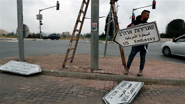 New road sign indicating the way to the new US embassy in Jerusalem al-Quds is set up on May 7, 2018. The embassy move from Tel Aviv to Jerusalem al-Quds is expected to occur on May 14. (Photo by AFP)