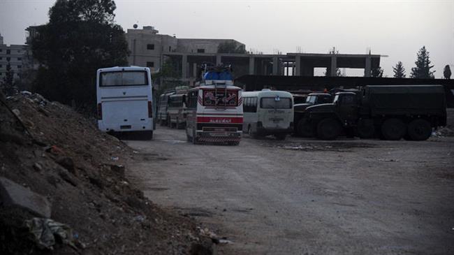 Terrorists and their relatives are bused from the towns south of the Syrian capital Damascus as part of a deal with the government, May 10, 2018. (Photo by SANA)