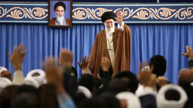 Leader of the Islamic Revolution Ayatollah Seyyed Ali Khamenei waves to participants at an international summit on the Shia role in the emergence and development of Islamic sciences, in Tehran, May 12, 2018. (Photo by Khamenei.ir)