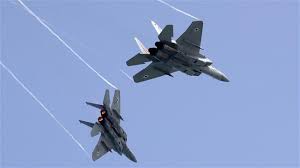 The photo taken on April 12, 2018 shows Israeli F-15 fighter jets performing a rehearsal in Tel Aviv. (By AFP)