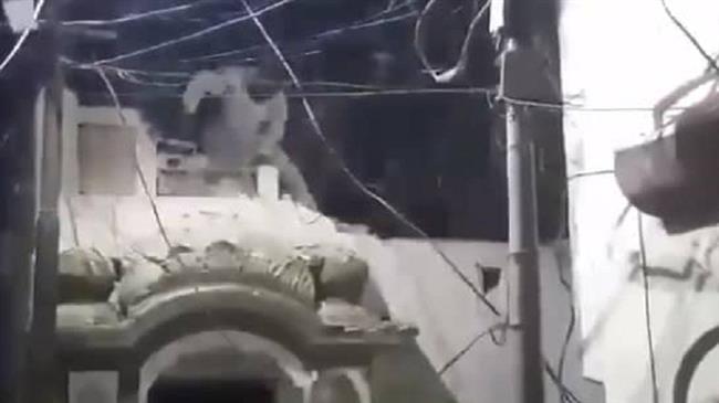 This image purportedly shows a person inflicting damage on a 100-year-old mosque belonging to Pakistan