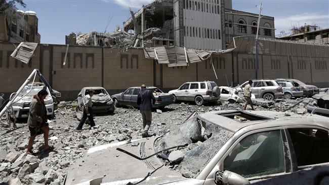 Yemenis check the site of Saudi airstrikes at the presidential office in the capital Sana’a on May 7, 2018. (Photo by AFP)