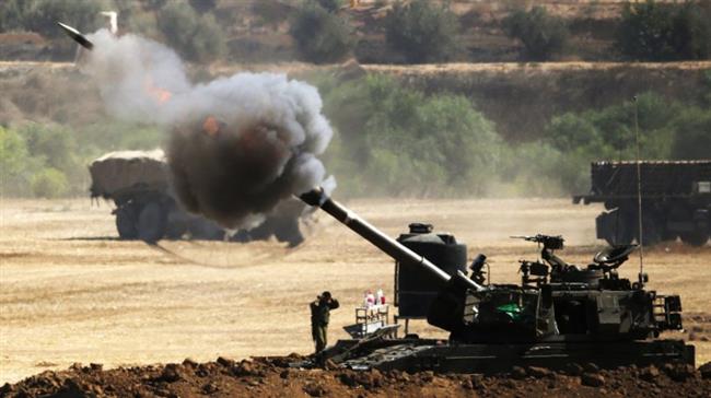 In this file picture, an Israeli artillery gun fires a 155mm shell towards targets near the border between the Gaza Strip and the occupied territories. (Photo by AFP)