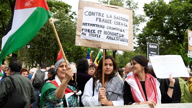 MP of French leftist party La France insoumise Eric Coquerel addresses protesters during a demonstration against the official visit to France by Israeli Prime minister and against the killings of 123 Palestinian protesters in Gaza by Israeli forces since March, on June 5, 2018 in Paris. (AFP)