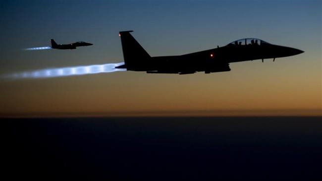 In this file picture, a pair of US Air Force F-15E Strike Eagles flies over northern Iraq after conducting airstrikes in Syria. (Photo by US Air Force)