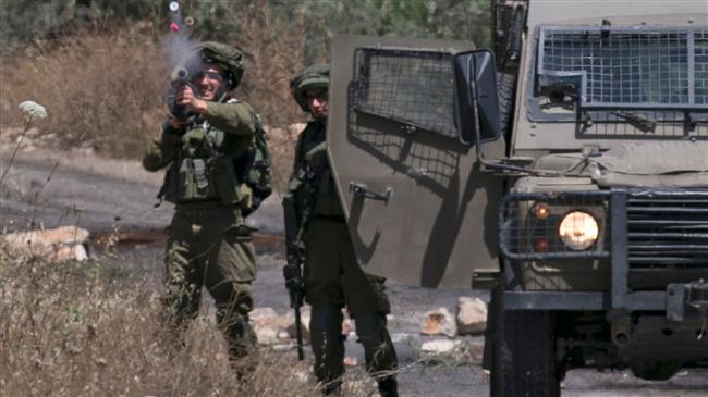 Israeli soldiers take position as Palestinian protesters clash with Israeli forces during a weekly demonstration against the expropriation of Palestinian land by Israel in the village of Kfar Qaddum, near Nablus in the occupied West Bank on May 18, 2018. (Photos by AFP)