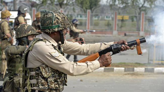 Indian police fire tear smoke shells during clashes in Srinagar, Kashmir, June 16, 2018. (Photo by AFP)