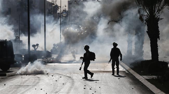 Israeli troops clash with Palestinian protestors in Ramalllah in the occupied West Bank, as demonstrations continued on December 11, 2017. (Photo by AFP)