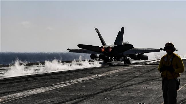 An F18 Hornet fighter jet pilot takes off from the deck of the US navy aircraft carrier USS Harry S. Truman in the eastern Mediterranean Sea on May 8, 2018. (Photo by AFP)