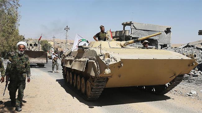 Armored vehicles and bulldozers of the Hashed Al-Shaabi (Popular Mobilization units) advance through the town of Tal Afar, west of Mosul, Iraq on August 26, 2017. (Photo by AFP)