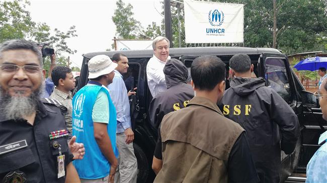 UN Secretary-General Antonio Guterres (C) arrives at the Kutupalong refugee camp for the Rohingya community in Bangladesh’s southeastern border district of Cox’s Bazar on July 2, 2018. (Photo by AFP)