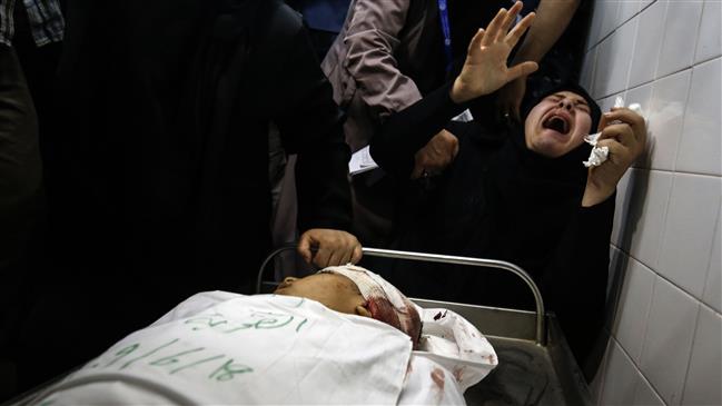 The aunt of Yasser Abu al-Naja, a Palestinian in his early teens who was killed in border clashes with Israeli troops near Khan Yunis, reacts at a hospital morgue in the besieged Gaza Strip, June 29, 2018. (Photo by AFP)