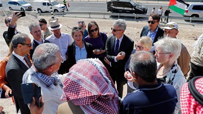 General consuls of France, Sweden, Belgium, Italy, Ireland, Switzerland, Finland and Denmark visit the Palestinian Bedouin village of Khan al-Ahmar, east of Jerusalem al-Quds in the occupied West Bank on July 5, 2018. (Photo by AFP)