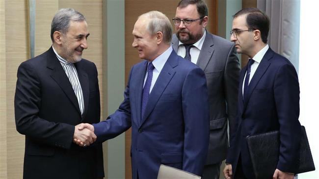 Russian President Vladimir Putin (R) shakes hands with Ali Akbar Velayati, foreign policy advisor to Leader of the Islamic Revolution Ayatollah Seyyed Ali Khamenei, during a meeting at the Novo-Ogarevo residence, outside Moscow, on July 12, 2018. (Photo by IRNA)
