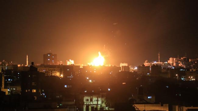 An explosion is seen in northern Gaza City after an airstrike carried out by an Israeli warplane on June 20, 2018. (Photo by AFP)