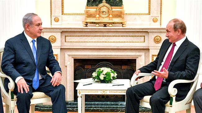 Russian President Vladimir Putin (R) speaks with Israeli Prime Minister Benjamin Netanyahu during their meeting at the Kremlin in Moscow on July 11, 2018. (Photo by AFP)
