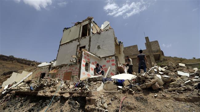Yemeni artists paint graffiti on a damaged building that was hit by a previous Saudi airstrike, during a campaign called