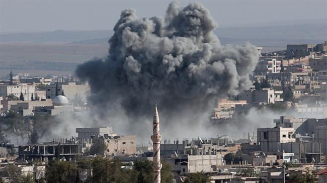 In this file picture, smoke rises above the Kurdish-populated city of Kobani, known as Ayn al-Arab, in Syria’s northern province of Aleppo following an airstrike by the US-led coalition. (Photo by AP)