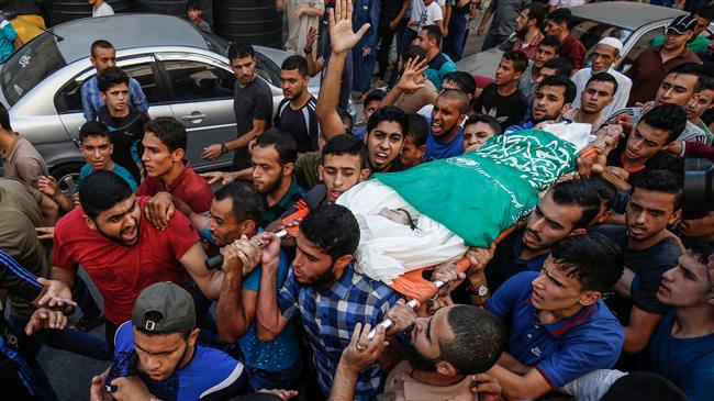 The photo, taken on July 17, 2018, during his funeral in Gaza City, shows Palestinian mourners carrying the body of 23-year-old Sari al-Shobaki, who died after being shot by Israeli forces in clashes along the Gaza border. (AFP photo)