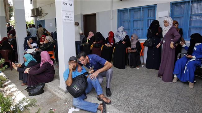 Palestinian employees of the United Nations agency for Palestinian refugees, UNRWA, take part in a protest against job cuts announced by the agency at its headquarters in Gaza City, July 25, 2018. (Photo by AFP)