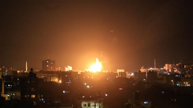 An explosion is seen in northern Gaza City after an airstrike by Israeli forces on June 20, 2018. (Photo by AFP)