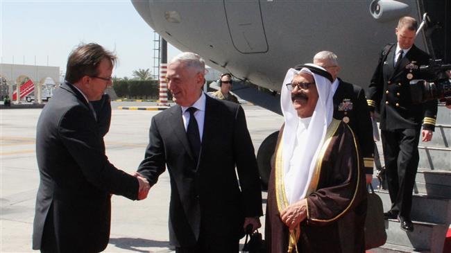US Defense Secretary Jim Mattis (C) is welcomed by Bahraini Minister for Defense Affairs