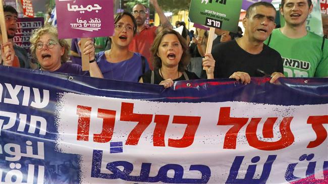 Demonstrators attend a rally to protest against the “Nation-State Bill” in Tel Aviv, July 14, 2018. (Photo by AFP)