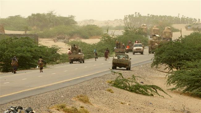 A column of Saudi-backed forces and armored vehicles arrives in Durayhimi district, about nine kilometers south of Hudaydah international airport on June 13, 2018. (Photo by AFP)