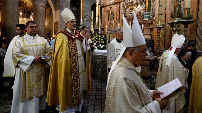 Apostolic Administrator of the Latin Patriarchate in the Israeli-occupied city of Jerusalem al-Quds, Pierbattista Pizaballa leads the Easter Sunday procession on April 1, 2018. (Photo by AFP)