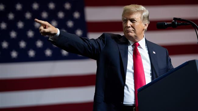 US President Donald Trump greets the crowd during a campaign rally at the Florida State Fairgrounds Expo Hall in Tampa, Florida, on July 31, 2018. (Photo by AFP)