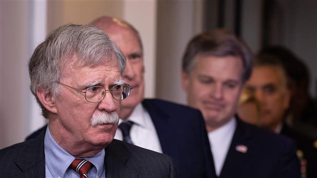 US National Security Advisor John Bolton (L), followed by National Director of Intelligence Dan Coats, FBI Director Christopher Wray and Commander of the US Cyber Command Gen. Paul Nakasone, arrive for the press briefing at the White House in Washington, DC, on August 2, 2018. (Photo by AFP)