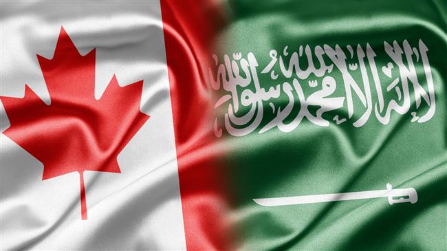 The national flags of Canada (L) and Saudi Arabia