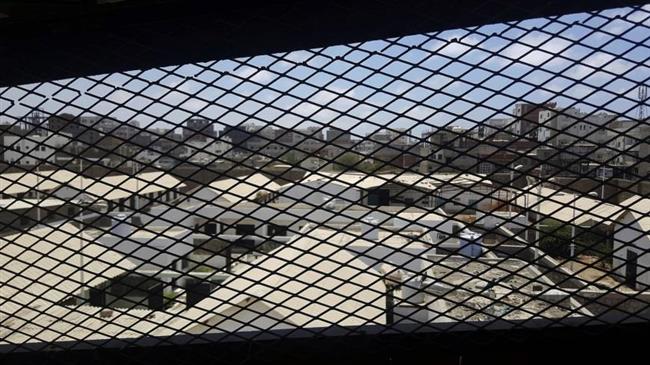 A view through a mesh window looks out over part of Aden Central Prison, known as Mansoura, in this May 9, 2017 photo in Aden, Yemen. (By AP)