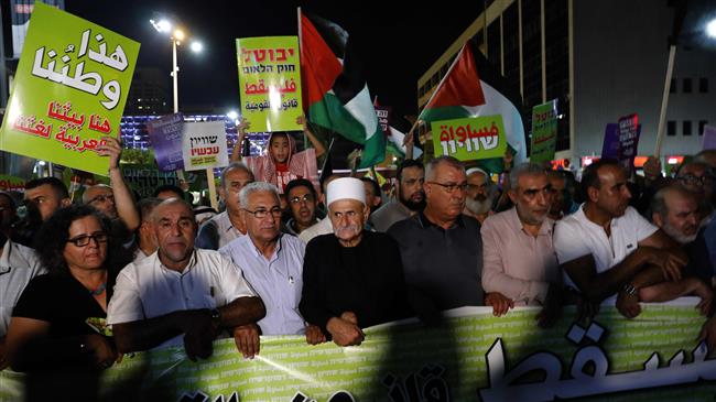 Druze protesters march with Arabs and their supporters during a demonstration against the “Jewish state” law in the city of Tel Aviv on August 11, 2018. (Photo by AFP)