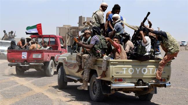 The file photo shows Saudi-backed militants carrying UAE flag aboard a vehicle in Yemen.