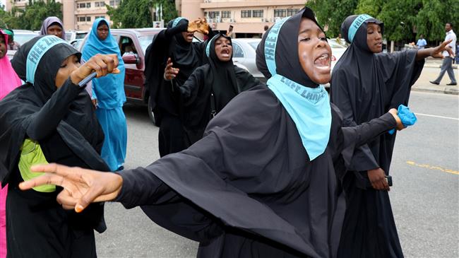Supporters chant slogans to march and press for the release of Nigerian Shia Muslim cleric Sheikh Ibrahim Zakzaky on May 14, 2018 in Abuja. (Photo by AFP)