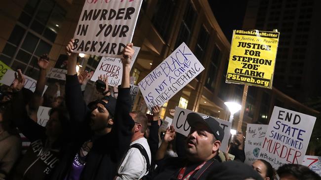 Black Lives Matter protesters stage a demonstration over the fatal police shooting of an unarmed black man in Sacramento, California, on March 30, 2018. (Getty Images)