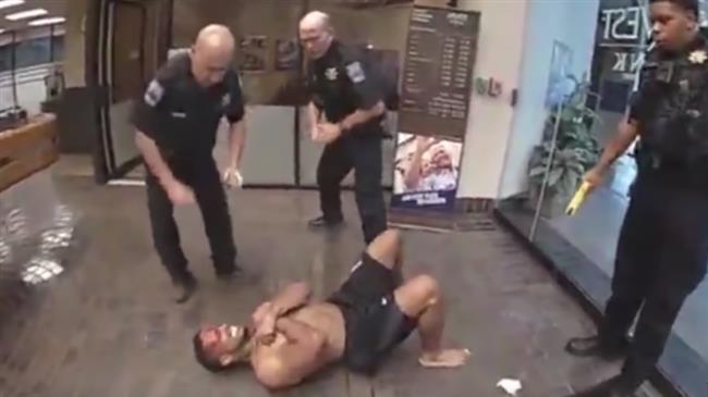 Police repeatedly tase a black man who later died in hospital.