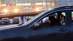 A Saudi woman test-drives a car during an automotive exhibition for women in the capital Riyadh on May 13, 2018. (Photo by AFP)