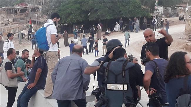 People gather in khan al-Ahmar on September 13, 2018 as Israeli forces prepare for razing the West Bank Palestinian village.