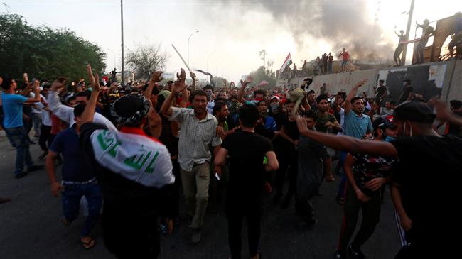 Iraqi people shout slogans during an anti-government protest near burnt government offices in Basra, Iraq, September 7, 2018. (Photo by Reuters)