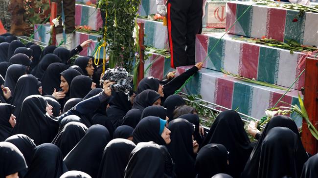 Iranians mourn during a funeral procession for Iranian soldiers martyred in Iraq’s 1980-1988 war against the Islamic Republic in Tehran, September, 13, 2018. (Photo by AFP)