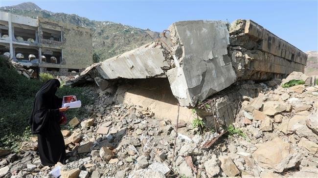 The file photo shows damage at the site of an airstrike on a school in Ta
