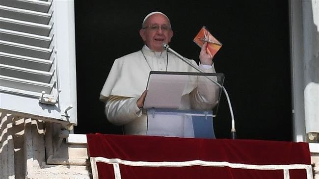 The file photo shows Pope Francis during the weekly Angelus prayer on September 16, 2018 at St Peter