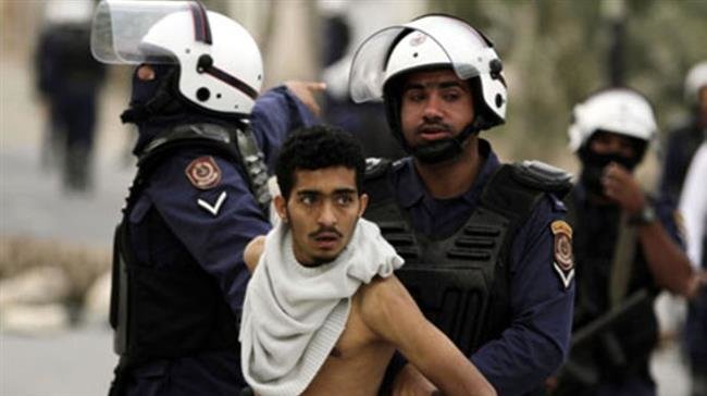 The file photo shows police arresting a Bahraini youth on March 20, 2012 during anti-regime protests in Muqsha, Bahrain, just west of the capital of Manama. (Photo by AP)