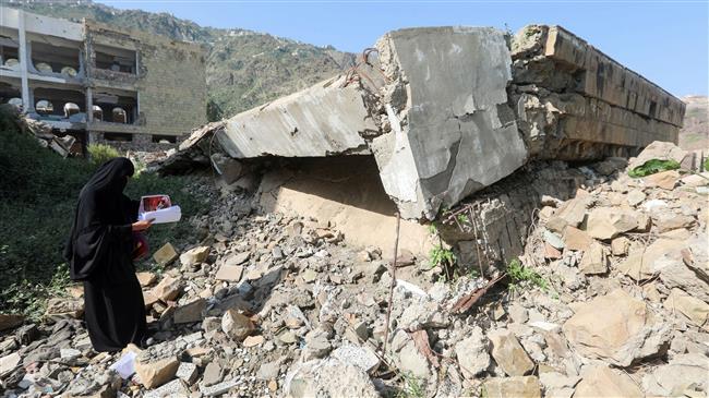 A Yemeni inspects the damage on the first day of the new academic year at a school on September 16, 2018. (Photo by AFP)