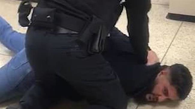 A police officer wrestles to the floor a Muslim man following a row at Tesco supermarket in Rochdale, Greater Manchester, on September 27, 2018. (Photo by Daily Mail)