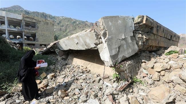 A Yemeni member of a school administration inspects the damage on the first day of the new academic year at a school that was damaged last year in a Saudi airstrike, in Ta’izz, Yemen, on September 16, 2018. (Photo by AFP)