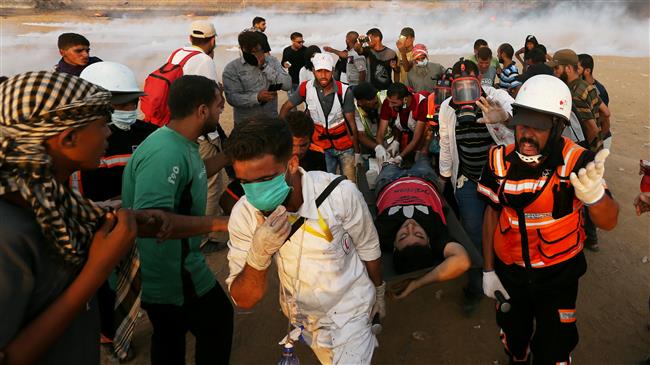 A wounded Palestinian is evacuated during a protest calling for lifting the Israeli blockade on Gaza and demanding the right to return to their homeland, at the border fence between the besieged Gaza Strip and Israeli-occupied territories on October 5, 2018. (Photo by Reuters)